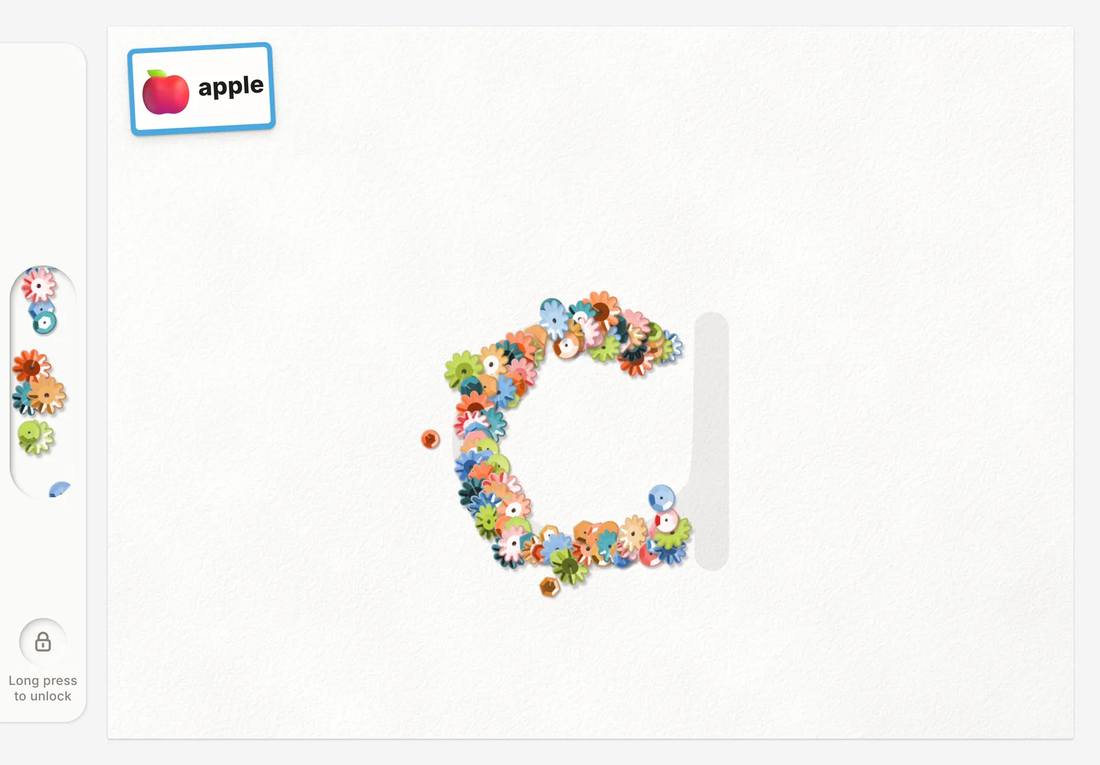 Magical Pen on an iPad: an apple picture card and a lowercase a partly traced in flower sequins, with a materials drawer on the left.